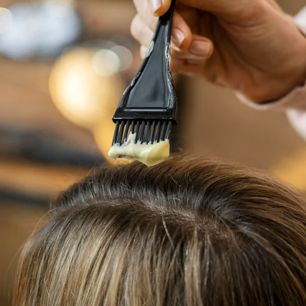 woman-getting-her-hair-dyed-home-by-hairdresser